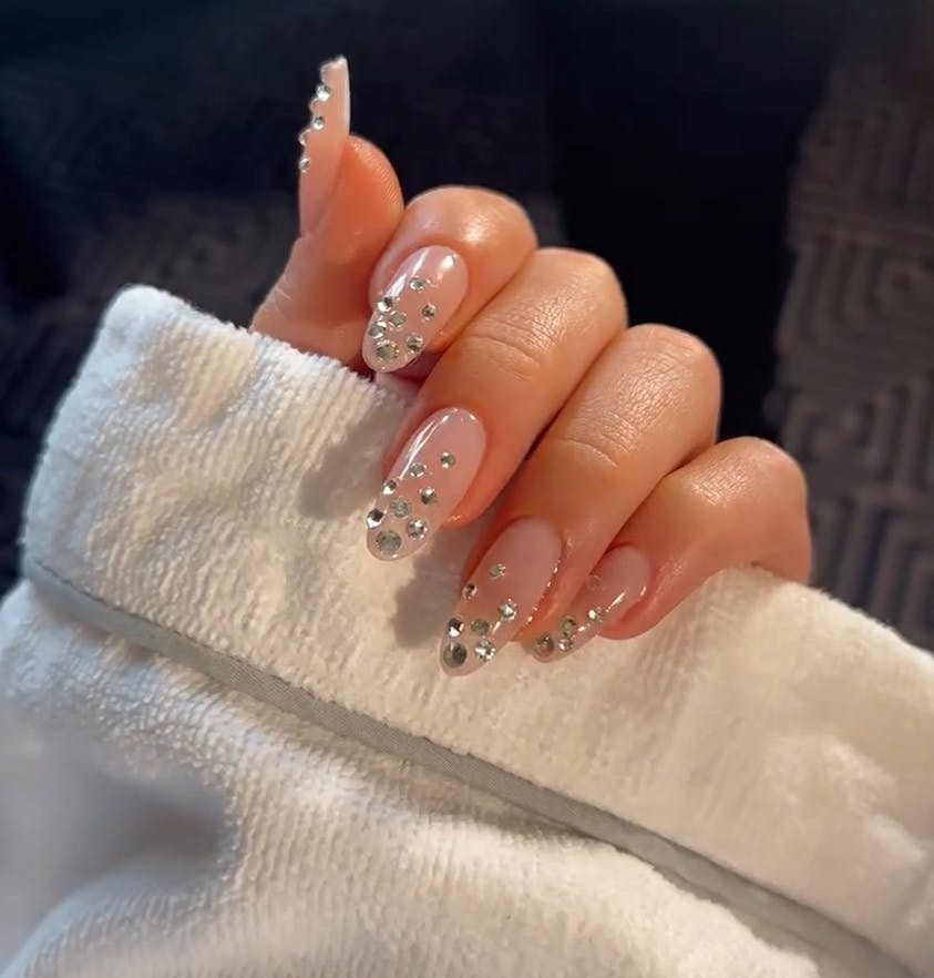 Nail artist Zola Ganzorigt created a crystal ombre nail look for Sydney Sweeney at the 2023 Met Gala.