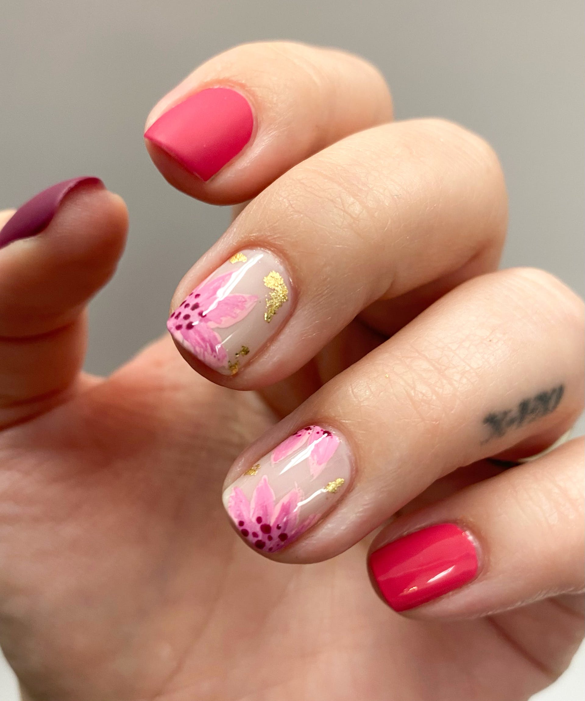 Pink floral nails with gold foil